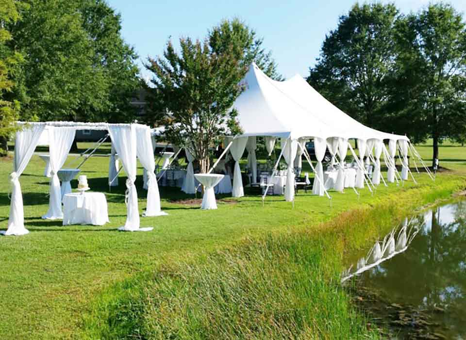 White Tent With Chairs and Table in The Garden